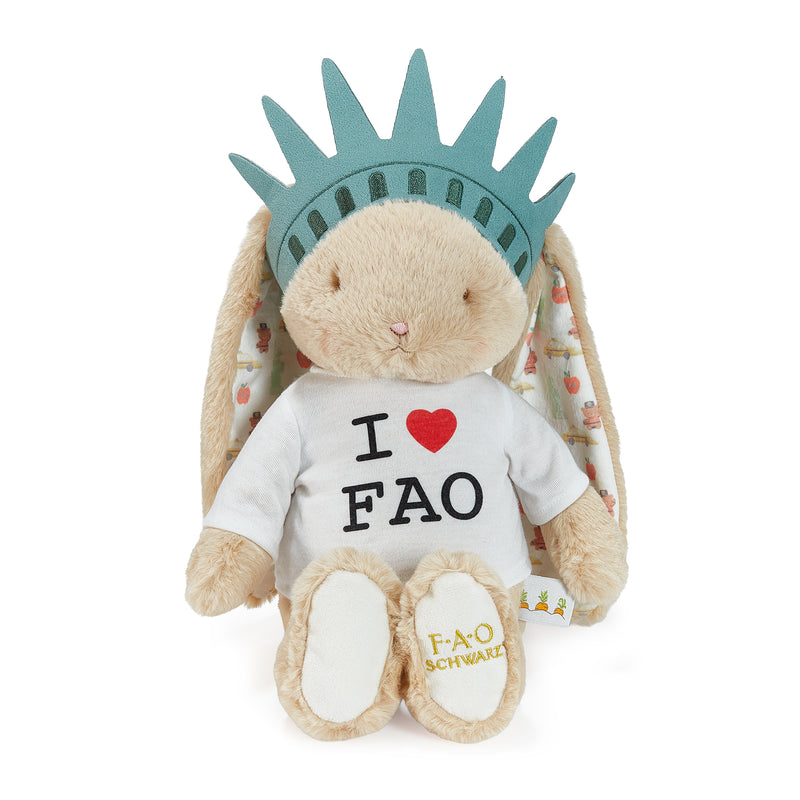 Plush toy resembling the Statue of Liberty with a t-shirt reading 'I ❤️ FAO' on a white background