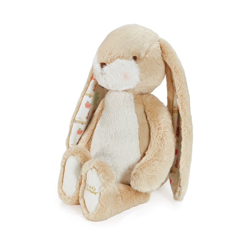Plush toy rabbit with a white belly on a white background