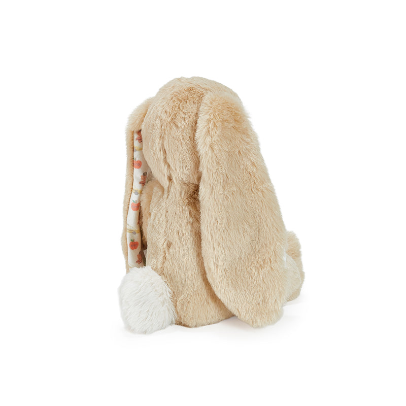 Beige plush bunny toy with long ears on a white background