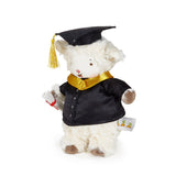 Stuffed animal toy in a graduation outfit with a cap and gown on a white background
