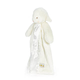 side view White plush toy with a blanket on a white background