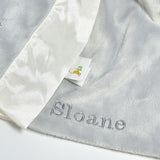 Gray and white fabric with 'Sloane' branding on a light gray background