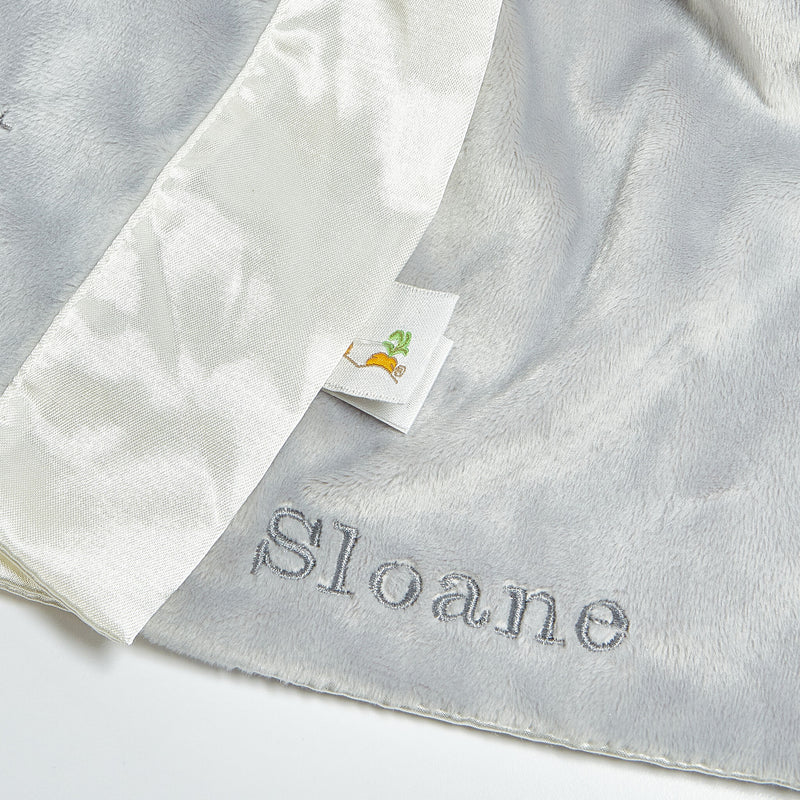 Gray and white fabric with 'Sloane' branding on a light gray background