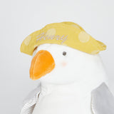 Close up of embroidered "Henry" on a yellow polka dot hat.
