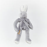 Gray bunny pacifier holder with "Ezra" embroidered on it in marigold colored thread.