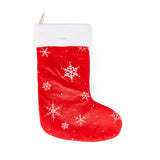 Red Christmas stocking with white snowflake patterns on a white background