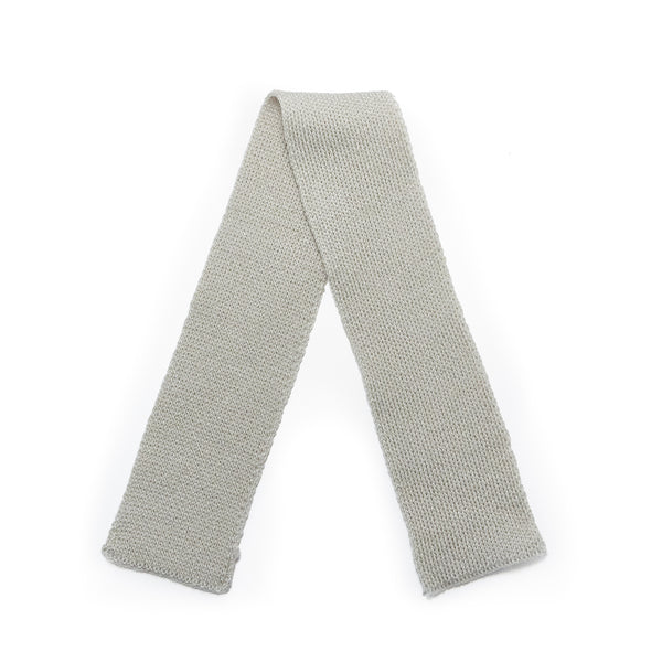 flat lay of Gray knitted scarf on a white background