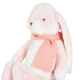 Plush bunny toy with a pink scarf on a white background
