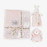 Baby gift set with pink blanket, plush toys, and security blanket featuring 'Bunnies by the Bay' branding.