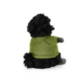 Black plush toy with a green knitted sweater on a white background