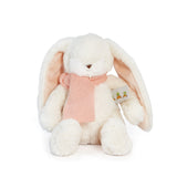 White plush bunny toy with a pink knit scarf on a white background