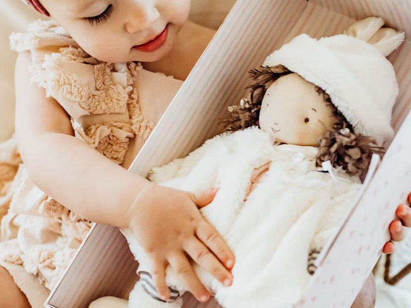 Baby with handcrafted unique doll